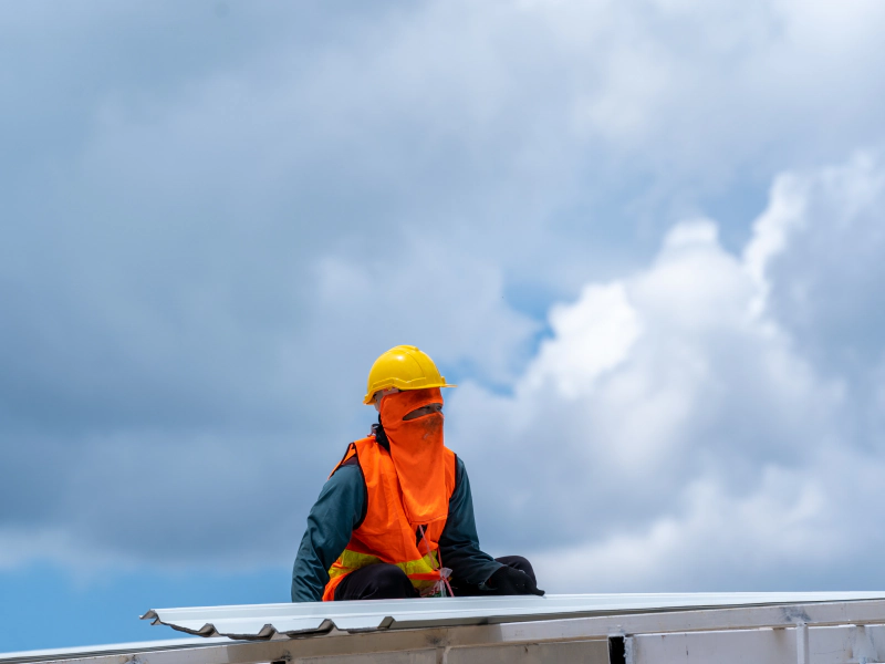 worker doing commercial roofing installation